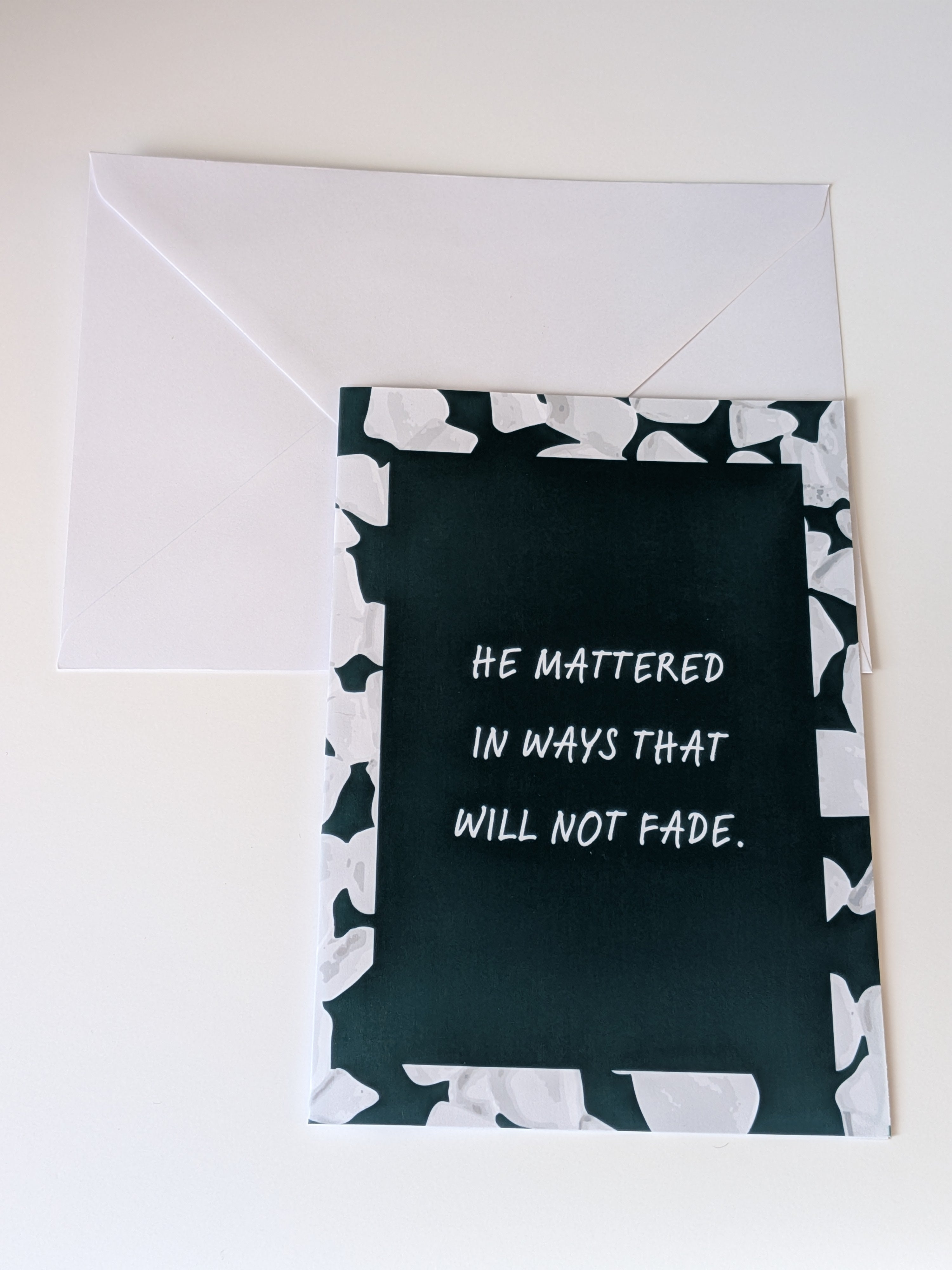Greeting card with text 'He mattered in ways that will not fade' on a white background